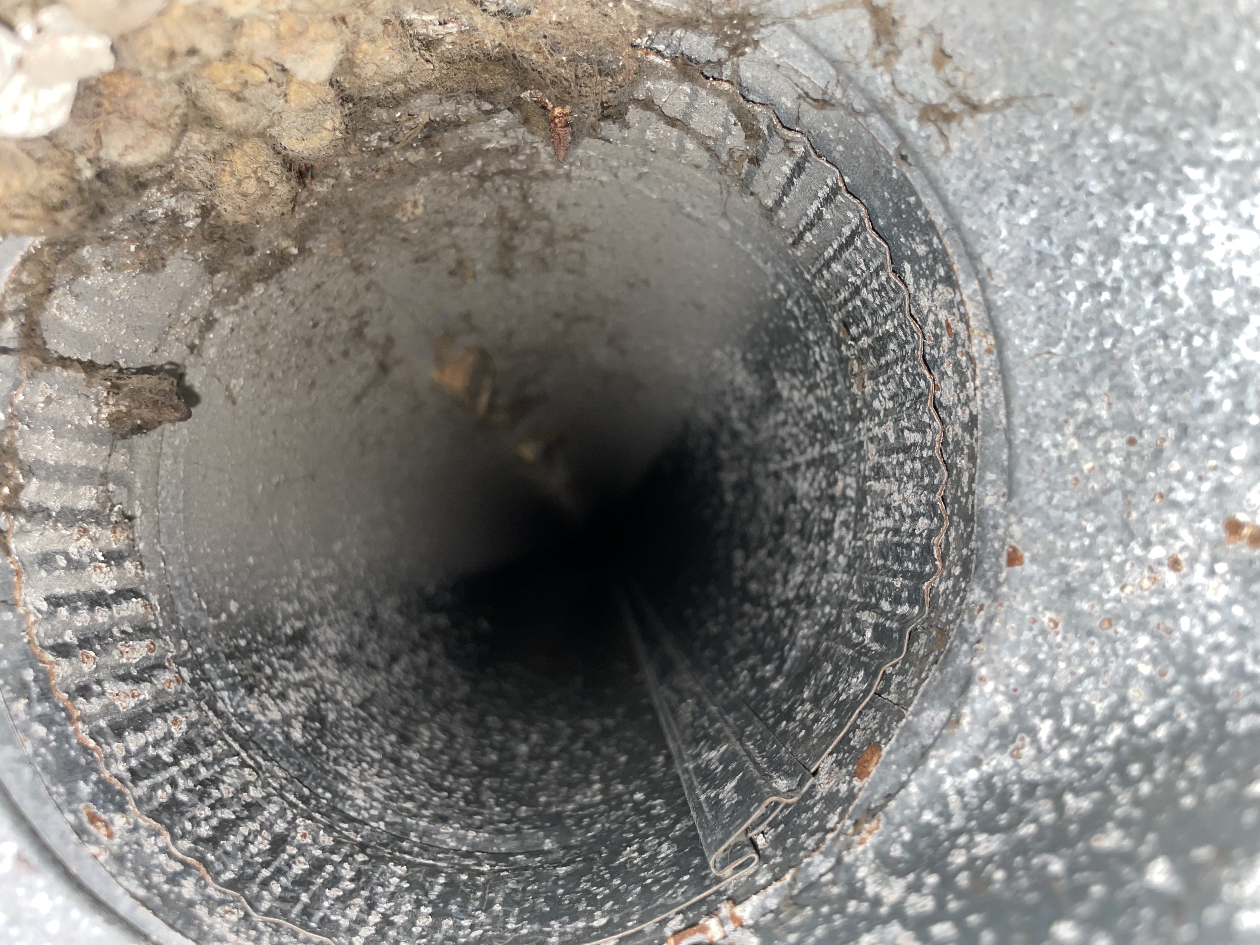 Inside view of dusty metal ductwork